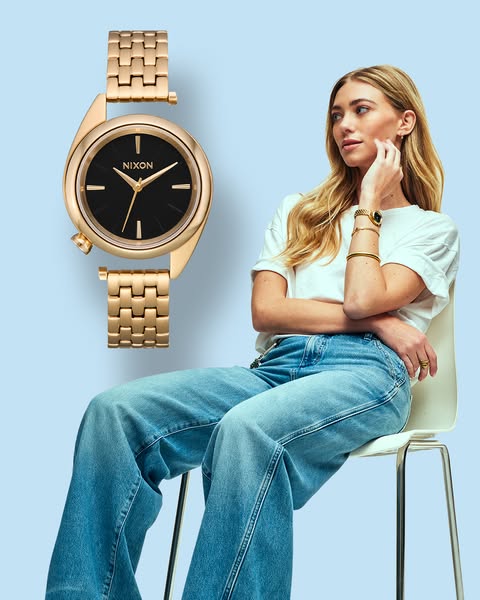 This ad features a Nixon watch on a woman, suggesting it as a stylish and accessible choice for everyday wear.