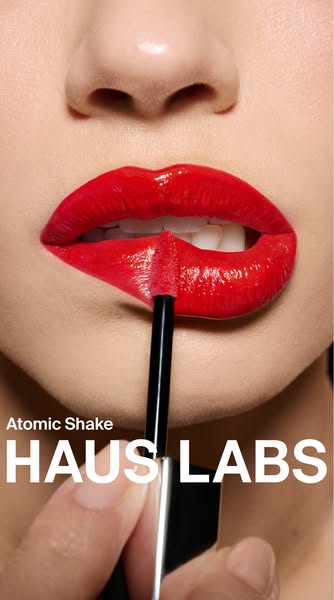 Close up of the Haus Labs Atomic Shake lip product being applied to lips.
