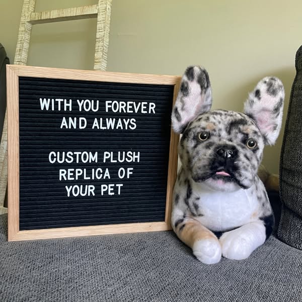 This ad features a plush replica of a dog next to a letter board that reads, "WITH YOU FOREVER AND ALWAYS CUSTOM PL