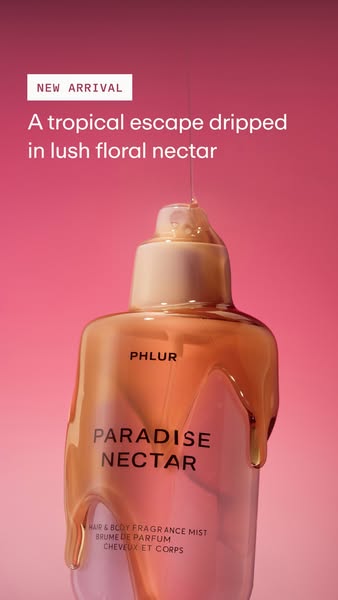The Phlur Paradise Nectar ad showcases the new hair and body fragrance mist by dripping what appears to be honey-like li