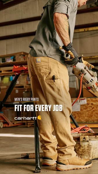 This ad for Carhartt's Men's Rigby Pants features a man using a power tool on a construction site. The pants are