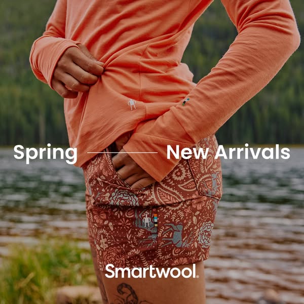 This ad for Smartwool features a person wearing the brand's apparel. The image focuses on the midsection of the pers