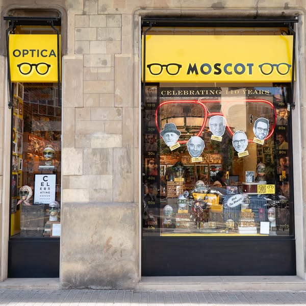 This image ad showcases the exterior of a Moscot optician store, celebrating 110 years of business. The ad highlights th