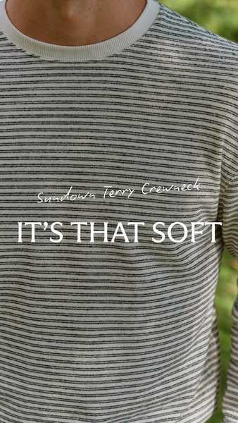 This ad showcases a striped crewneck sweater, highlighting its softness. The ad uses a close-up shot of the sweater worn