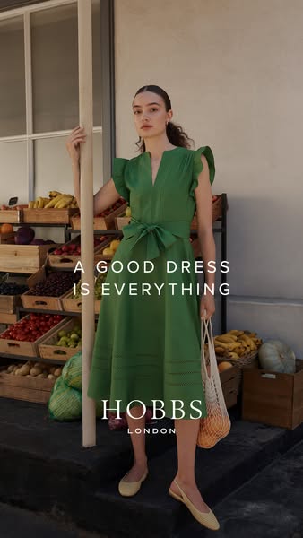 This image ad showcases a green dress from Hobbs London. The ad features a woman in a green dress at what looks to be a 