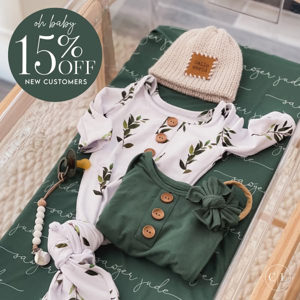 This image ad showcases a collection of baby clothing and accessories, emphasizing a 15% discount for new customers. The