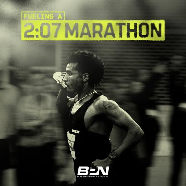 This ad uses a monochromatic image of a marathon runner to promote a brand of performance nutrition. The runner is holdi