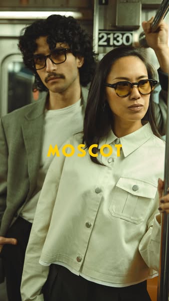 Image ad featuring two people on the subway wearing MOSCOT frames. The ad appears to be targeted at those who are intere
