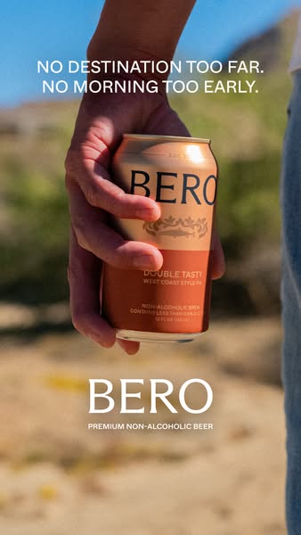 This image ad is for BERO non-alcoholic beer. The ad shows a person holding a can of BERO in a desert landscape with the
