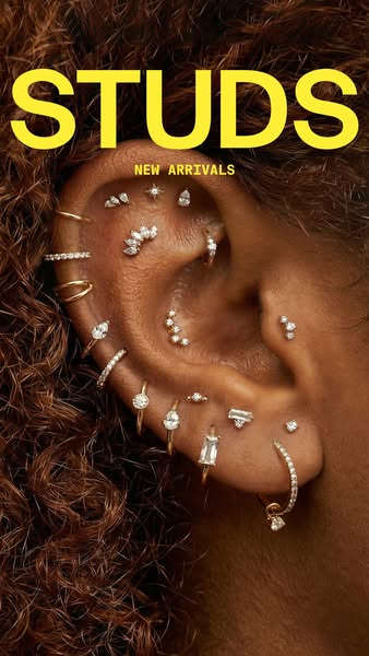 This image ad from Studs showcases a close-up of an ear adorned with a variety of earrings, highlighting the brand's