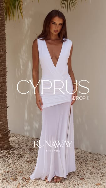 This is an image ad for Runaway The Label, featuring a model in a white dress from their new Cyprus Drop III collection.