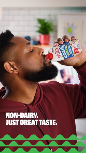 This ad features a man drinking a carton of Premier Protein non-dairy protein shake. The text overlay emphasizes the tas