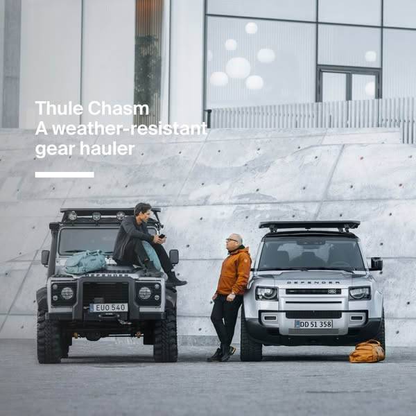 This image ad showcases the Thule Chasm weather-resistant gear hauler. Two vehicles are prominently displayed with two m