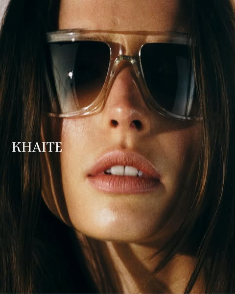 This ad shows a close up of a woman wearing Khaite sunglasses and promotes the brand.