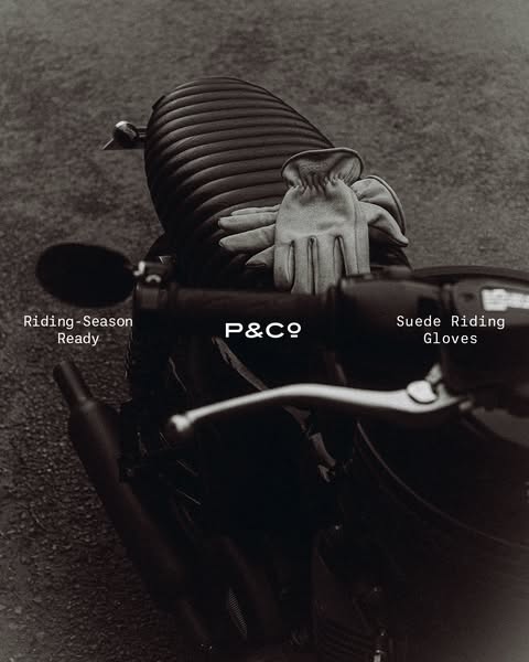 A black and white image showcases motorcycle gloves on a motorcycle seat. The image and text are meant to communicate th
