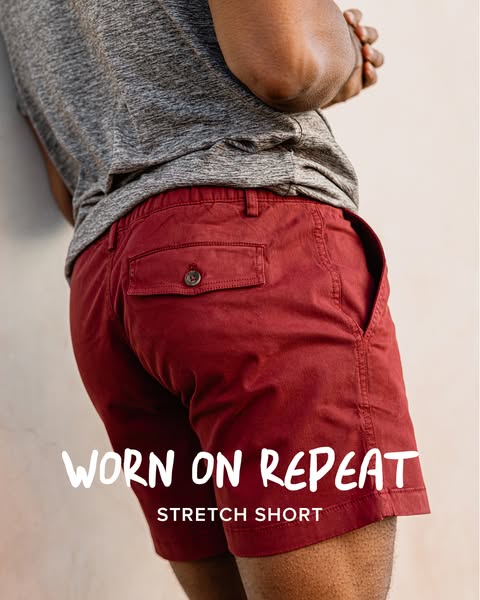 This ad features a man wearing red stretch shorts, with the copy 'Worn on Repeat' and 'Stretch Short' ov