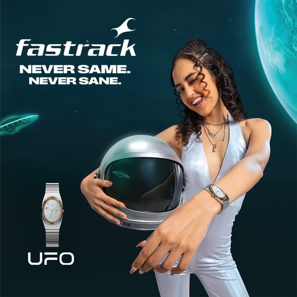 This image ad for Fastrack watches presents a futuristic and unconventional concept, featuring a woman in a silver jumps
