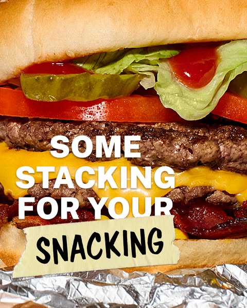 This ad features a close up of a burger, with the text "Some Stacking For Your Snacking". The ad appears to be