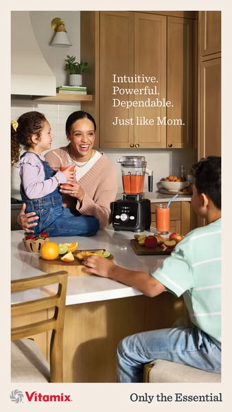An image ad for Vitamix shows a mother holding her daughter and smiling, while the daughter holds a cup of a smoothie. T