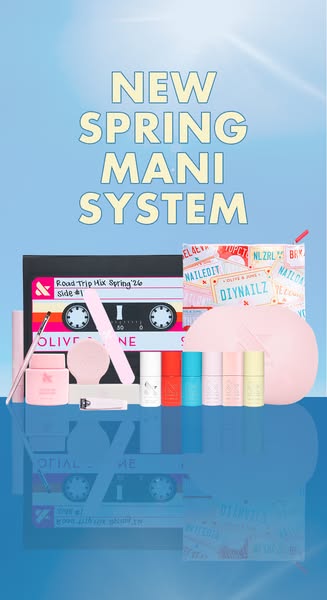 A still image ad showcasing a mani system from Olive & June. The image features a flatlay of the various components 