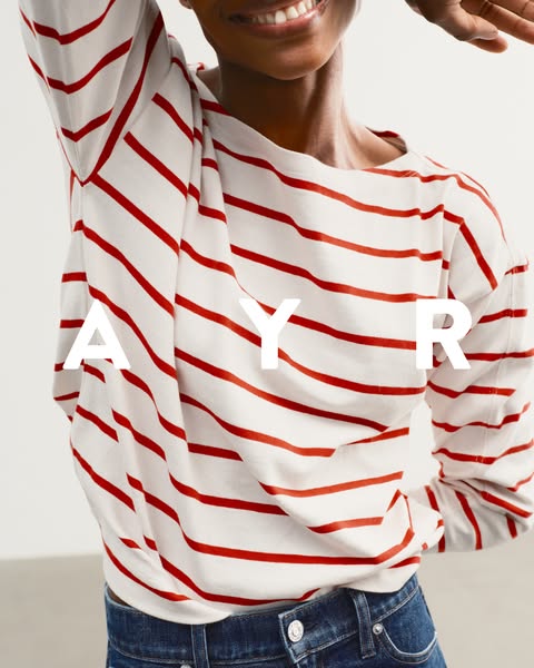 This ad showcases a woman wearing a striped AYR shirt. The brand name is prominently displayed over the image of the shi