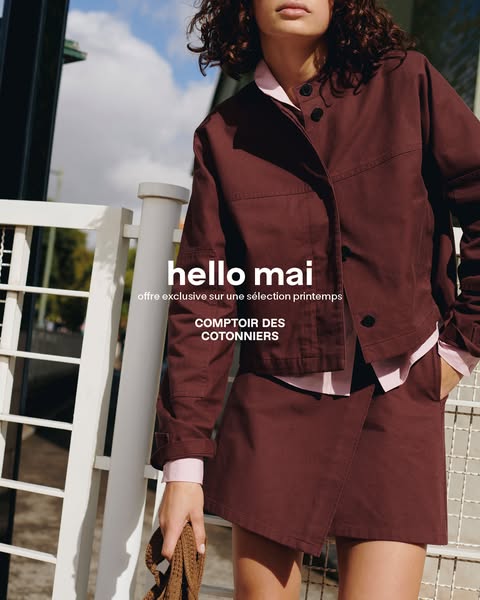 An outdoor image of a female model wearing a jacket and matching skirt from COMPTOIR DES COTONNIERS. The ad promotes a l