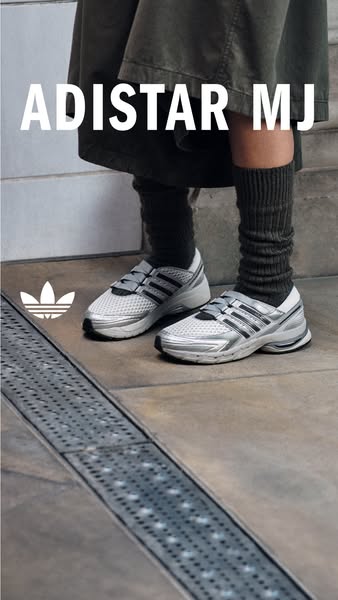 This ad showcases a close-up of the Adidas Adistar MJ sneakers worn by someone standing on a tiled surface.