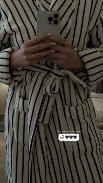 This ad features an image of a person wearing a robe, holding a smartphone in front of them to presumably take a photo o
