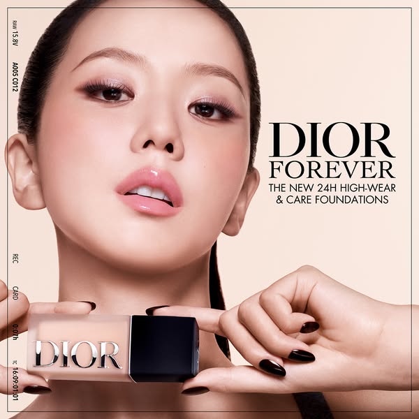 This ad promotes Dior Forever foundation featuring a model applying the product.