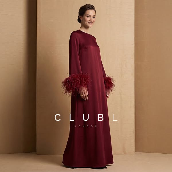 This ad features a woman wearing a red dress with feathered sleeves, promoting Club L London. The ad is a simple product