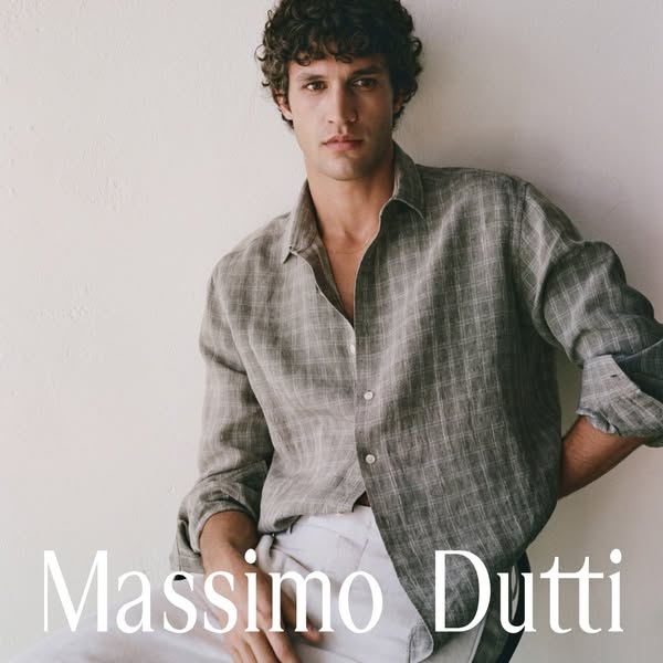 An image ad for Massimo Dutti featuring a man wearing a button-down shirt.