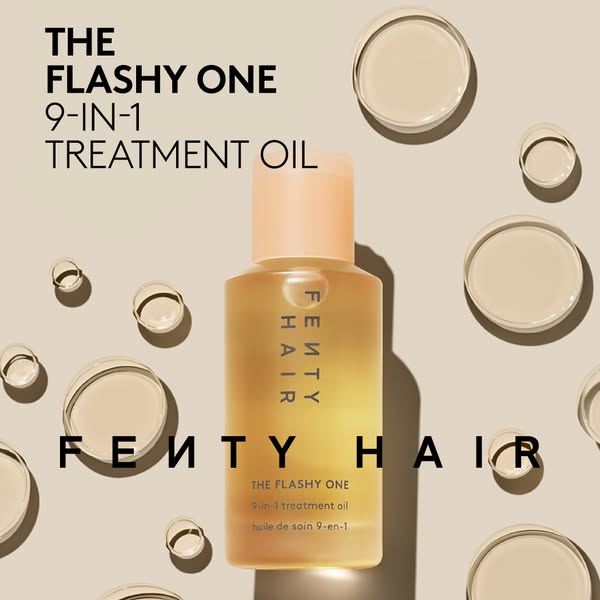 This image ad showcases Fenty Hair's 'The Flashy One' 9-in-1 treatment oil. The ad features the product bott