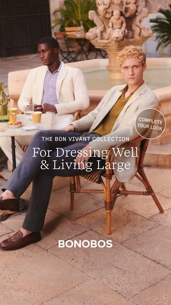This ad for Bonobos features two men dressed in formal wear sitting outdoors in a stone courtyard. The ad is showcasing 