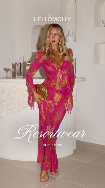 This image ad features a young woman wearing a brightly colored floral two-piece outfit with a seashell-shaped clutch. T
