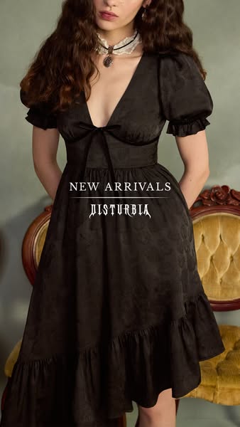 This image ad showcases a new black dress from the brand Disturbia. The model is seen wearing the dress indoors.