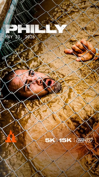 This ad promotes a Philly run in 2026, featuring a person partially submerged in muddy water behind a chain link fence.