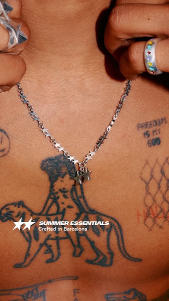 This ad features a close up of a model wearing a silver necklace with star embellishments. The ad displays the brand log