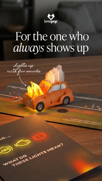 This ad features a Lovepop card that is an orange car with flames and smoke coming out of the hood, with a play on the e