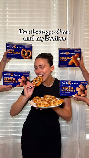 This ad features an image of a woman enjoying Auntie Anne's pretzels, surrounded by boxes of different Auntie Anne&#