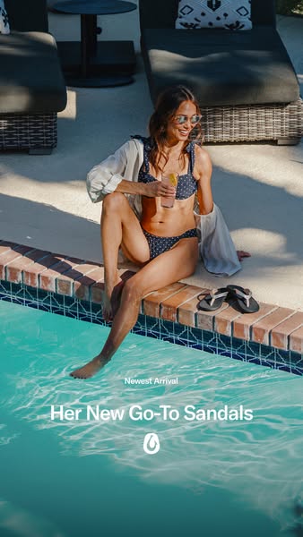 This ad showcases a woman sitting near a pool, wearing a bathing suit and OluKai sandals. It is designed to highlight th