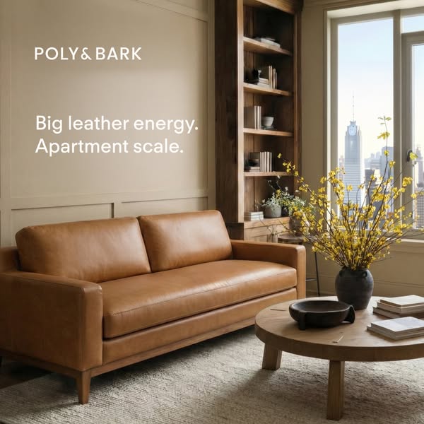 The ad features a beautifully staged living room with a modern, tan-colored leather sofa as the focal point. The headlin