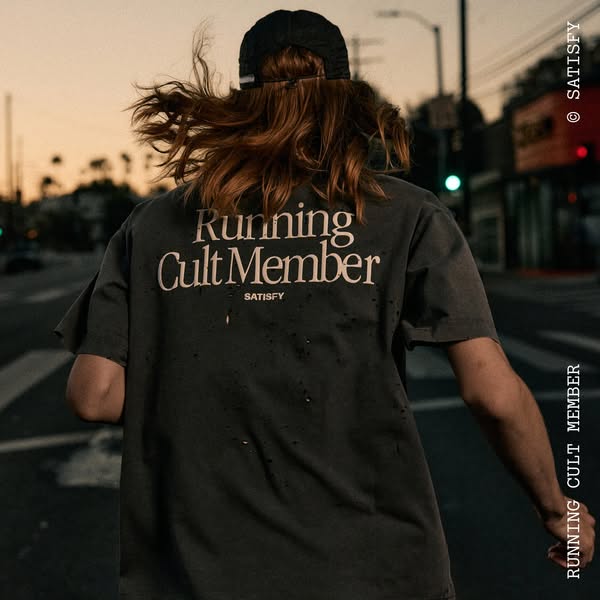 This ad features a person running, showcasing a t-shirt with the phrase "Running Cult Member", reinforcing the