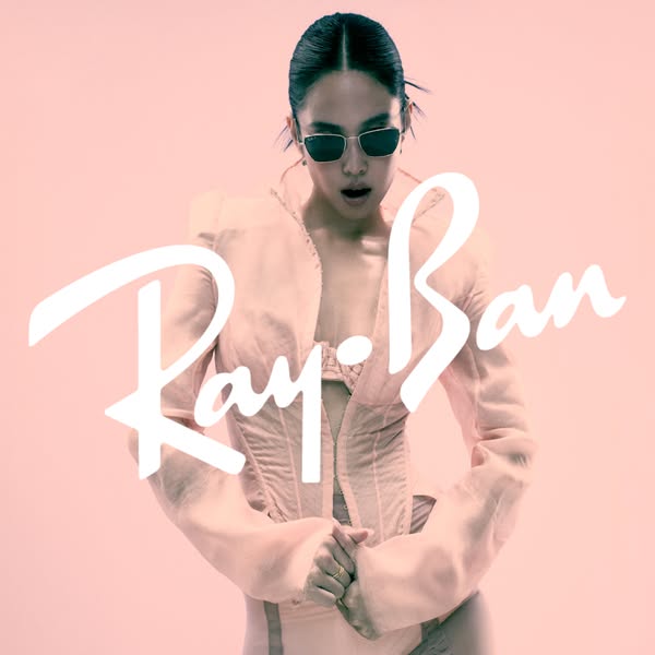 An image featuring a model wearing Ray-Ban sunglasses with the brand's logo prominently displayed, set against a mut