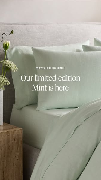 The image ad features a close-up of a bed with light green sheets and pillowcases. The ad announces the arrival of the l