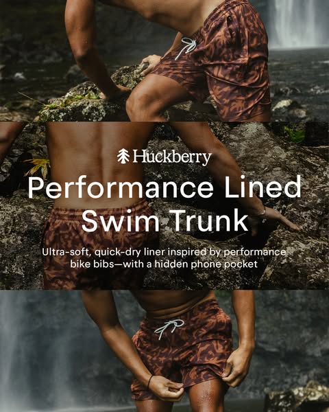 An image ad for Huckberry's performance-lined swim trunks. The ad shows a shirtless man wearing the trunks, near a w