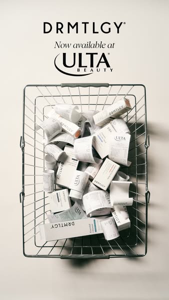 This image ad announces that DRMTLGY products are now available at Ulta Beauty. The ad features a wire basket filled wit