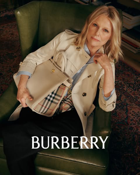An image features an older woman sitting in a chair. She is holding a Burberry purse. The image is intended to evoke fee