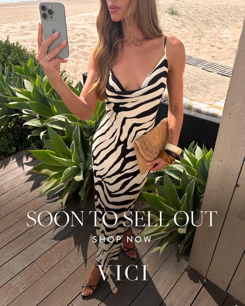 This ad features a woman posing in a zebra-print dress from VICI, set against a beach backdrop. The ad uses a direct cal