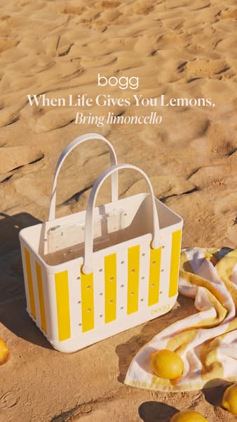 The image ad showcases the Bogg bag on the beach, surrounded by lemons and a striped towel. It uses a play on words, tel