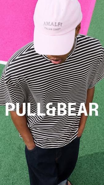 This ad features a person wearing a striped t-shirt, dark jeans, and a pink baseball cap against a background of green a